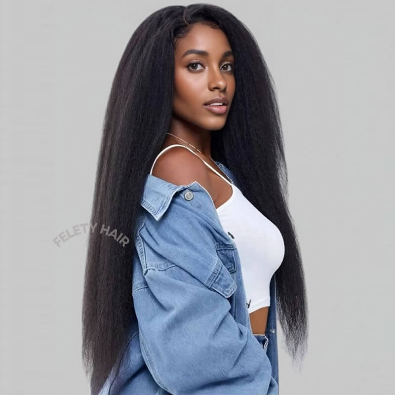 Black woman over 40 smiling, wearing blowout clip-in extensions.