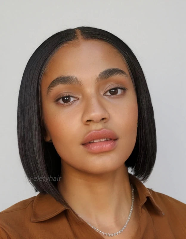 Black woman smiling, wearing glueless black bob wig
