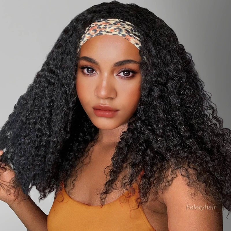 Black woman wearing kinky curly black headband wig